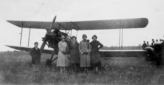 public inspecting biplane